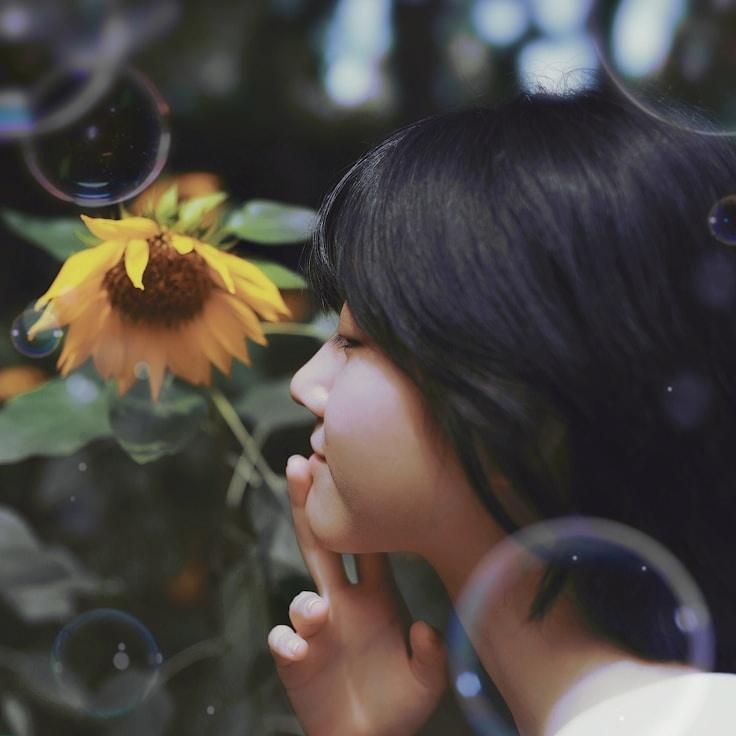 Anaya Singh, Lead Design Curator at HarborRippleSun, reviewing corporate floral arrangements